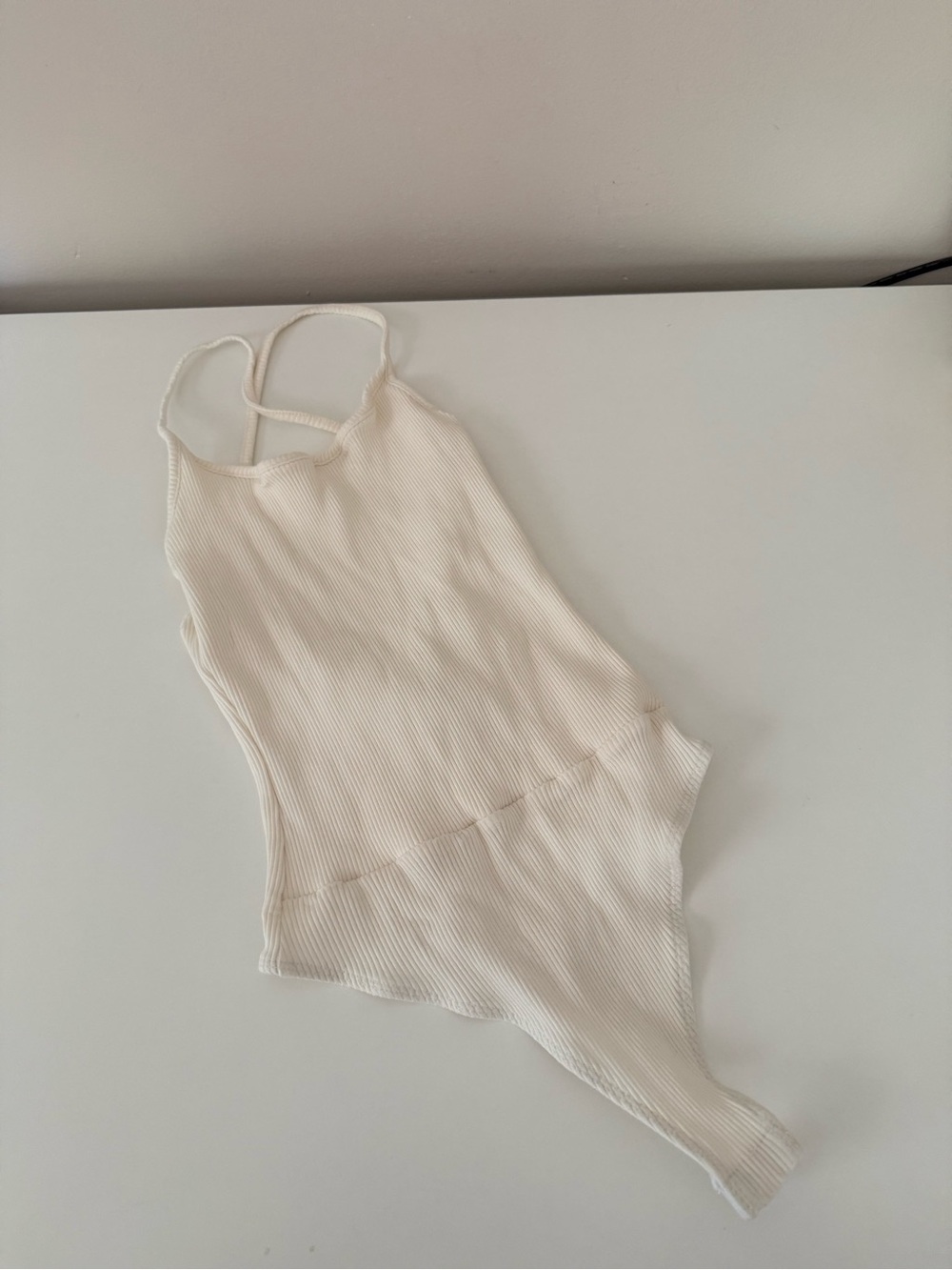 Lulu’s Ribbed Cream Seamless Strappy Bodysuit